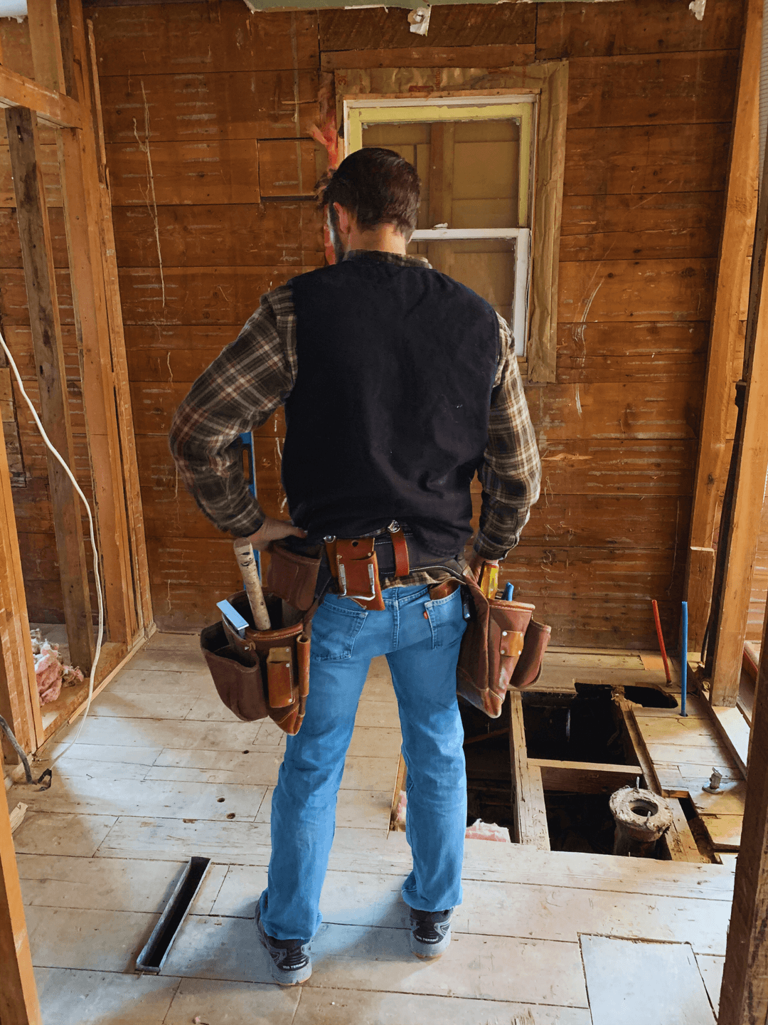 Josh reviewing plumbing work with a homeowner